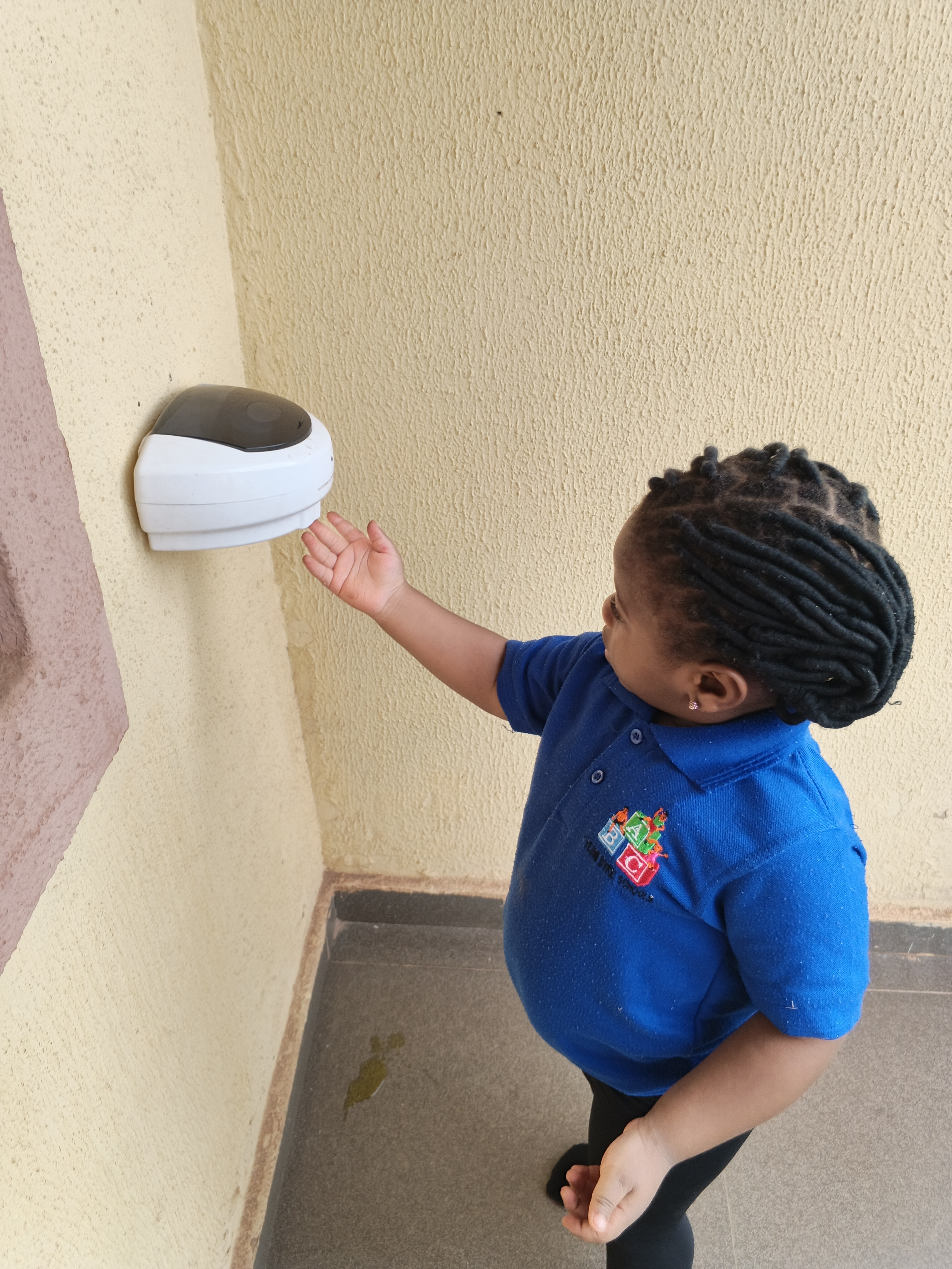 A young child picking papers